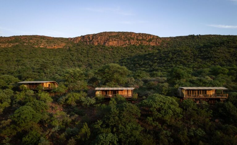 Luxury safari lodge overlooking tranquil African wilderness This is the ideal version because: • It tells exactly what the user sees • It boosts SEO for “luxury safari lodge” and “African wilderness” • It is actionable for screen readers • It stays in a refined, premium tone aligned with Engo Tours